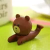 Tecknad film mjukt gummi kreativ lat handenhet konsol vacker brun björn laddning säte mobiltelefon konsol tv-ram
