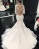 2021 Gorgeous Lace Mermaid Bröllopsklänningar Sheer Neck Dubai Afrikansk Arabisk Style Långärmad Fishtail Brudklänning Plus Storlek Illusion Bodice