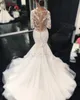 2021 Wspaniałe koronkowe sukienki ślubne syreny Sheer szyi Dubaj African Arabic Style Fishtail Bridal Suknia Plus 2378