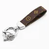 Designer Keychain PU Läder Rope för påsar Mobiltelefonremmar Charms Hängande Neck Creative Small Present Activity Luxury Key Ring