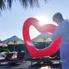الجملة-صافي حمراء سميكة دائرة السباحة الحب نفخ حلقة السباحة على شكل قلب على شكل قلب حلقة الصليب النماذج الانفجار