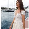 Romantyczny szampana boho Suknie ślubne z rękawami Cap Dubai Arabskie Aplikacje Suknie ślubne Sheer Back Tulle Sukienki ślubne 2019