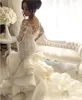 Rufffles lange Kapelle Zug Vintage Meerjungfrau Brautkleider mit langen Ärmeln 2021 Arabisch Sheer Hals Spitze Vestidos Brautkleider Al3396
