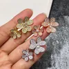 Joyería de moda Llena de trébol de diamantes Seis flores Apertura Flor doble Anillo de plata de oro rosa para mujer