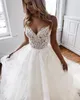 Incredibile una linea di abiti da sposa senza schienale in pizzo con scollo a V in rilievo abiti da sposa da spiaggia Sweep Train Tulle Appliqued Boho Vestidos De Noiva