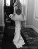 Långa klänningar 2020 sjöjungfru poet ärmar v hals sexig ihålig rygg svep tåg pärlspets applikation bröllop klänning klänning de mariee