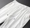 Новые летние мужские брюки роскошные шелковистые прохладные эластичные талию мужчины повседневные брюки плюс размер 3xl 4xl Fashion Ice Silk White Man