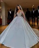 Luxury Arabic Sheer Long Sleeves Satin Ball Gown Bröllopsklänningar 2020 Dubai Beaded Crystals Ruched Chapel Train Bröllop Bröllopklänningar CPH044