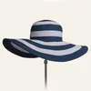 jujuland 2018 Nuova Estate Femminile Cappelli da sole Cappello con visiera Tesa larga Nero Bianco Cappello di paglia a strisce Casual Cappellini da spiaggia per le donne C1908122965