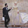 Toppkvalitet 2019 Arabiska muslima Bröllopsklänningar med Overkirt High Neck Långärmad Beaded Gold Lace Naken Rosa Tulle Muslim Bride Dress