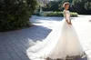 Mezze maniche in pizzo arabo vintage Una linea Abiti da sposa principessa Abiti da sposa principessa in tulle con perle lunghe a bateau con retro trasparente