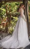 Sexy Amazing A-Line Wedding Dresses with Rhinestones Crystals Major Beading Backless Long Sleeves Ball Gown Arabric Dubai Bridal Gowns