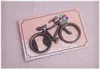 サイクリング恋人の結婚式の好意的な党ギフトカードの包装のためのビンテージの金属の自転車の自転車の形のビールのびんのオープナー