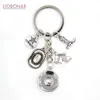 Nyankomst Partihandel 18mm Snap Smycken Cowboy Nyckelring Handväska Charm Western Cowboys Hatt Stövlar Snap Keychain Nyckelring Presenter för män kvinnor