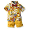 Üst ve Üst Boy Giyim Seti Yaz Moda Çiçek Kısa Kollu Bowtie Gömlek Şortları Erkek Günlük Giysiler Beyefendi 2pcs Suit6180763