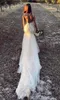 Sexig v hals sjöjungfru bröllopsklänningar spaghettiband tiered tyll handgjorda blommor rygglöst svep tåg bröllop klänning brudklänningar