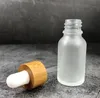 5 10 15 ml 30 ml 50 ml Flacons compte-gouttes en verre transparent dépoli avec bouchon en bambou 1 oz Bouteille d'huile essentielle de bambou logo personnalisé
