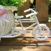 白い三輪車の自転車のデザインの花のバスケット収納容器DIYパーティーの結婚式の植物の装飾熱い