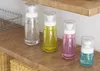 100個30ml 60ml 100mlの液体化粧品の空のボトル瓶ディスペンサー旅行の化粧ポンプコンテナ