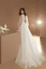 Bohemian A Line Dresses Sheer Jewel Neck Lace Applique Bridal Gowns Tulle Beach Boho dragkedja Back Wedding Dress