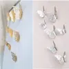 12 PCS Farfalla tridimensionale cava oro e argento Adesivi murali 3D Decorazioni murali camera Decorazioni soggiorno Adesivi murali TV