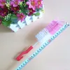 Brosse de nettoyage de bouteille de lait pour bébé de qualité alimentaire en gros avec crochet mélange de couleurs pratique mamelon alimentation eau Tee tasse brosse DH0449