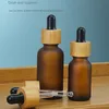 100pcs Frosted Amber Clear Glass Dropper Bottle 15ml 30ml 50ml with Bamboo Cap 1oz Wooden Essential Oil 5ml 10ml 20ml Packaging Bottles