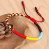 Nya flerfärgade tibetanska buddhistiska knutarmband Good Lucky Red Rope Charm Flätade armband för kvinnor män