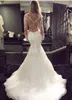 2021 Wunderschöne Spitze Meerjungfrau Brautkleider Sheer Neck Dubai African Arabic Style Long Sleeves Fishtail Brautkleid Plus Size Illus2378