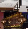 Neueste Kronleuchter Südostasien Balance Yi Eisen Pendelleuchten LED geschnitzte hohle Retro-Lampen für Esszimmer Restaurant Laterne De Lampe