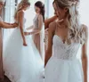 Strand Bröllopsklänningar 2020 Baklösa Lace Appliques Pearls Spaghetti Straps A-Line Boho Bridal Gowns Robe de Marie Billiga