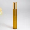 Hot Sale 10 ml bruine glazen aromatherapie etherische olierolflessen 10 ml parfum monsterrolflessen met gouden plastic dop
