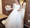 Magnifique robes de mariée en dentelle transparente creux arrière à manches longues une ligne prres des robes nuptiales royales balayent les vestidos de sentier de noiv4130292