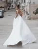 Simple Une Ligne D'été Robe De Mariée Avec Des Poches Sexy Dos Nu Sans Manches Ceinture Perlée Plage Jardin Robe De Mariée Robes De Mariee