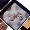 Het ny modedesigner Super Glittering Diamond Zircon Rhinestone Double Hollow Ball Studörhängen för kvinnliga flickor Sier Pin