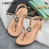 Lakeshi T- 스트랩 신발 여성 샌드 샌들 여름 평평한 샌들 2019 보헤미안 플립 플롭 여성 신발 로마 캐주얼 해변 샌들 슬립 온