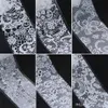 10st / set spetsöverföringsfolie Svart vita nagelklistermärken Hollowblomma Sliders Genomskinliga dekaler Wraps Nail Art Decoration Set
