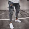 Les hommes de poche multi-poche ont détruit un jean skinny détruit un pantalon bleu nostalgique à zéppe décontracté effilochée