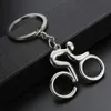 20 sztuk / partia Metalowa jazda rowerowa Brelok Moda Sport Key Chains Cool Man Torba Wisiorki Urok Kobiet Akcesoria Biżuteria Hurtownie