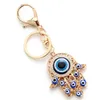 Hollow fatima hamsa hand kalkoenblauwe ogen sleutelhange ketting legering glazen kwade eye keychains auto handtassen accessoires kreeft sluiting