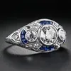 Omhxzj hurt europejski trzy kamienne pierścienie moda kobieta man man imprezowy prezent ślubny luksusowy owalny biały niebieski topaz cyrkon 18KT biały złoty pierścień RR651