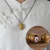 Tibet Bouddhisme Surangama Mantra Rotatif Pendentifs Collier Amulette Sanskrit Collier Six Mots Roue Hommes Femmes Tube De Rangement Cas Bijoux