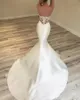 2019 New Sexy Sweetheart Mermaid Abiti da sposa Appliques di pizzo Perline Senza maniche Backless Sweep Train Arabo Plus Size Abiti da sposa formali