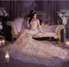 2019 Luxury Robe de mariée scintillante automne sexy bling en dentelle perlée Applique High Necfil Illusion à manches longues Champagne Chapelle Bride Bridal