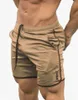 Hommes respirant maille Cool Shorts été plage pantalons courts hommes gymnases Fitness entraînement musculation survêtement Crossfit vêtement de sport fin