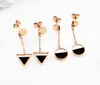 Wholesale- titanium steel black and white double-sided four-leaf clover cute small fish temperament elegant tassel earrings female fashio