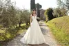 Sexy elegante weiße Spitze eine Linie Brautkleider schiere Flügelärmel Tüll Spitze Applique Hochzeit Brautkleider Robe de Mariée mit Knöpfen