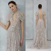 2020 Argent Robes De Soirée Halter Épaule Manquante Appliqued Dentelle Paillettes Robes De Soirée Dos Nu Sur Mesure Balayage Train Robes De Bal