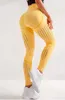 新しいスタイルの桃のヒップフィットネスパンツ女性のシームレスな高いウエストタイトヨガパンツ迅速な乾燥と換気のズボン