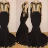 Sexy Black Mermaid Evening Dresses Jewel Neck Backless Long Sleeves Gold Lace Appliques Crystal Beaded Sweep Train Prom Dress Party Gowns
